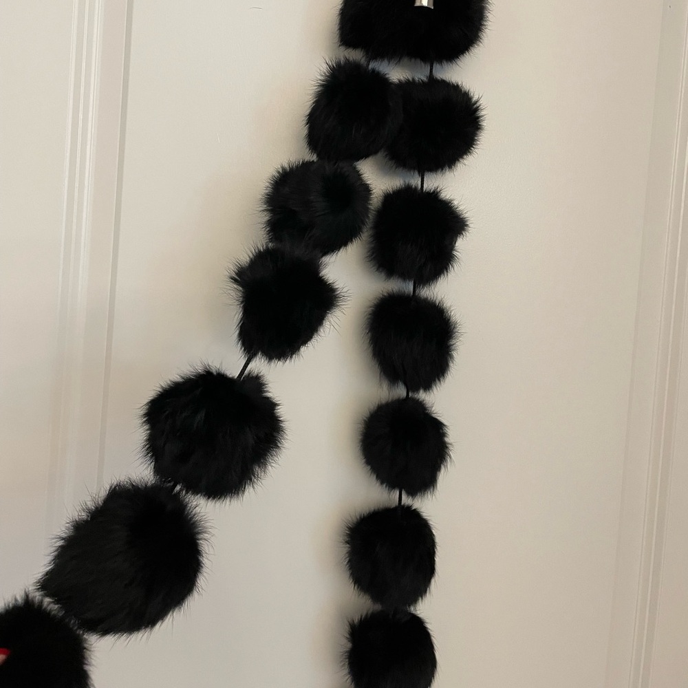 Fun faux fur boa of pom poms!